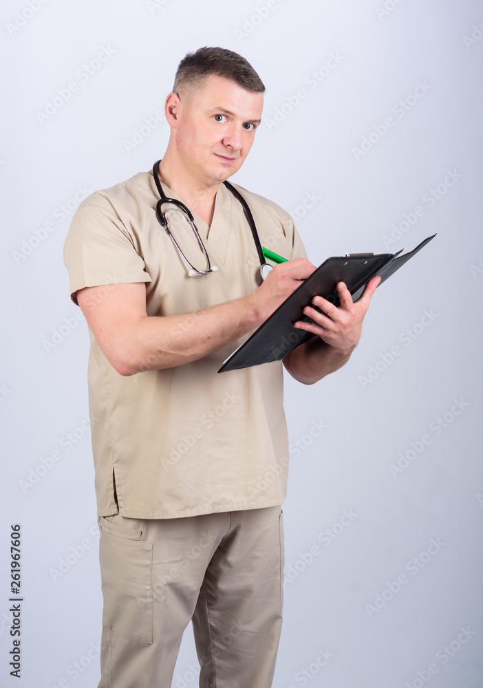Medicine and health care. Private clinic. Professional doctor. Experienced doctor beige clothes on white background. Check health. Doctor career. Man doctor with stethoscope physician uniform Medicine and health care. Private clinic. Professional doctor. Experienced doctor beige clothes on white background. Check health. Doctor career. Man doctor with stethoscope physician uniform