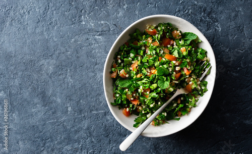 Healthy summer tabule salad bowl top view copy space photo