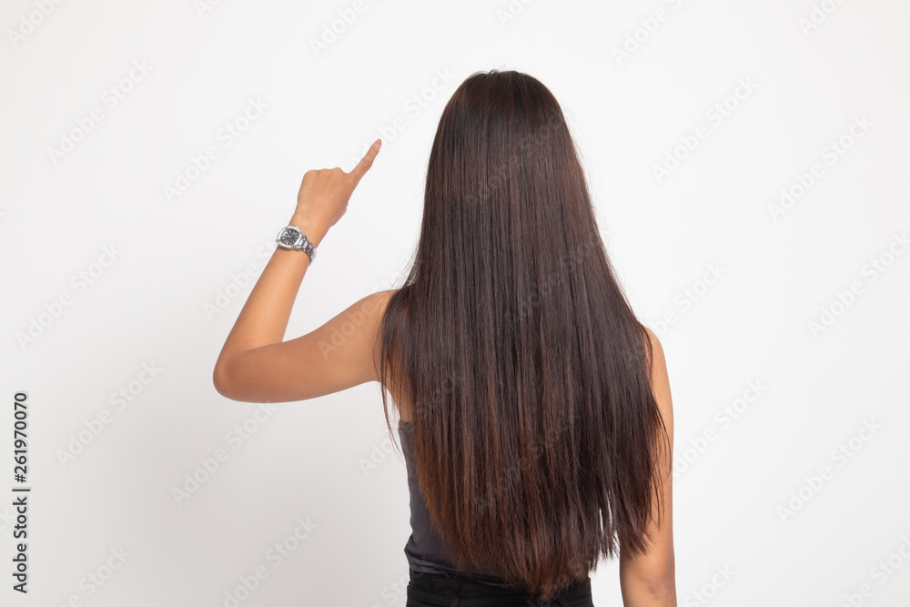Back of Asian woman touching the screen with her finger. Back of Asian woman touching the screen with her finger.