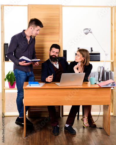 Woman attractive lady working with men colleagues. Office collective concept. Coworkers communicate solving business tasks. Working together. Managing process. Working in male dominated job