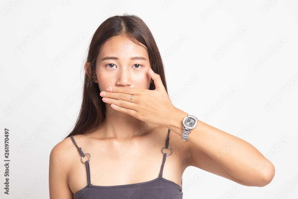 Young Asian woman close her mouth with hand. Young Asian woman close her mouth with hand.
