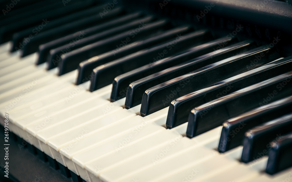 Piano keyboard with selective focus. Side view of piano keys. Conservatory Philharmonic music craft Piano keyboard with selective focus. Side view of piano keys. Conservatory Philharmonic music craft