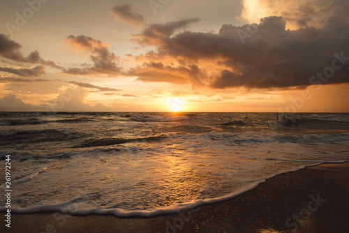 Sunset on the beach with beautiful sky . Sunrise on the beach .