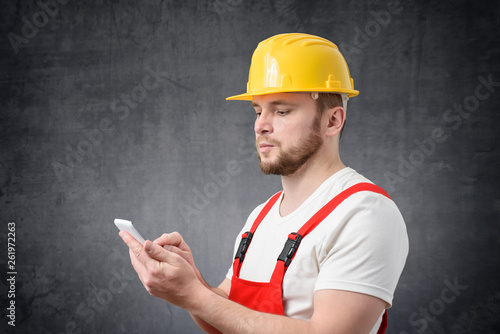 Construction worker using smartphone