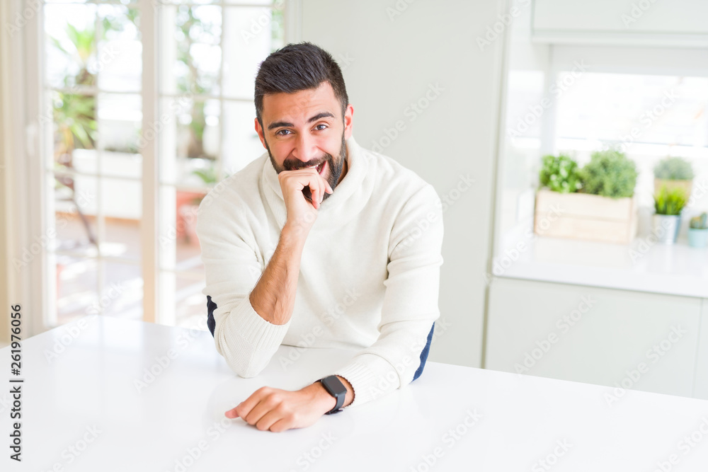 Handsome man smiling cheerful with a big smile on face showing teeth, positive and happy expression Handsome man smiling cheerful with a big smile on face showing teeth, positive and happy expression
