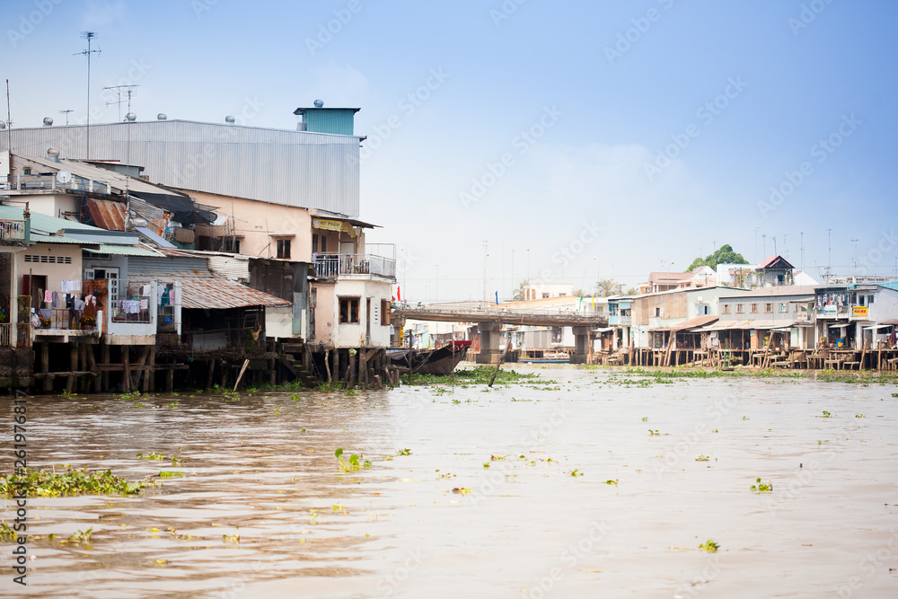 JAN 28 2014 - MY THO, VIETNAM - Houses by a river, on JAN  28, 2014, in  Mekong Delta, Vietnam