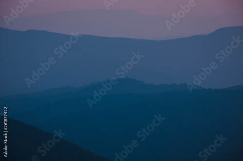 evening mountains silhouettes © Andrii