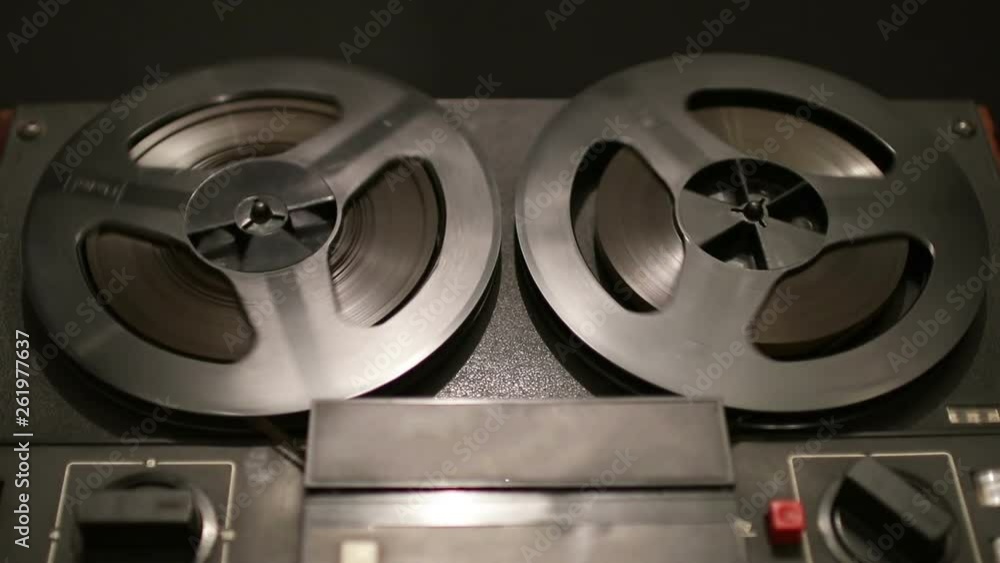 Old coil tape recorder with magnetic tape on reels Old coil tape recorder with magnetic tape on reels