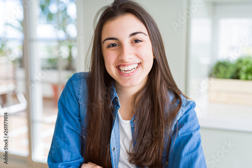 Free Download Beautiful young brunette woman smiling cheerful looking at the camera with a big smile on face showing teeth - GFXLoad