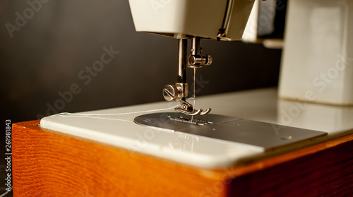 Background type of sewing machine, tailoring process. sewing workshop.