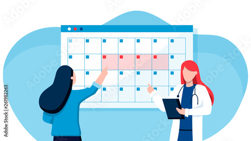 A young woman marks the date of menstruation in the online calendar. An application to track your menstrual cycle and birth control. Online doctor gynecology