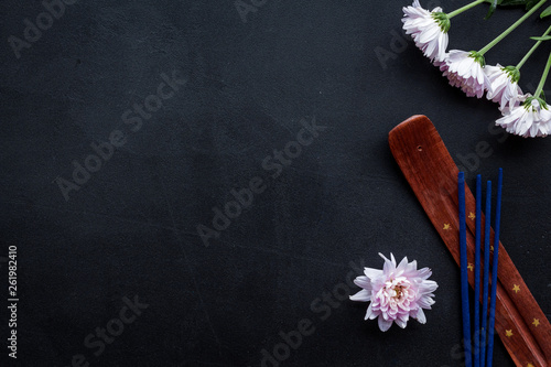 floral fragrance diffuser for air freshness on dark background top view mock-up