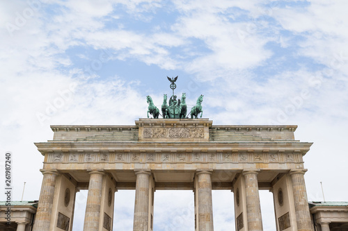 Famous neoclassical Brandenburg Gate (Brandenburger Tor) in Berlin, Germany, on a cloudy day. Copy space.