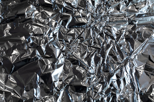 Silver foil shiny metallic texture background wrapping paper for Christmas and winter holiday wallpaper decoration element