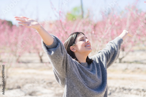 Photography Beautiful young woman smiling cheerful with closed eyes and open arms enjoying s