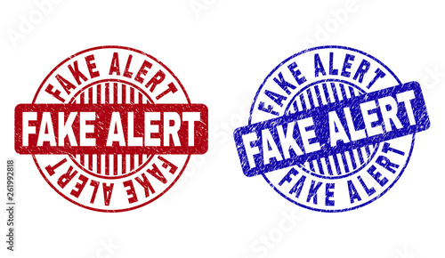 Grunge FAKE ALERT round stamp seals isolated on a white background. Round seals with grunge texture in red and blue colors. Vector rubber overlay of FAKE ALERT label inside circle form with stripes.