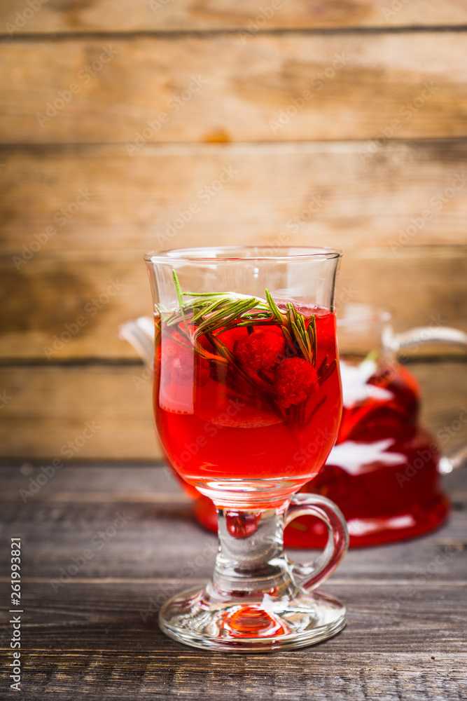 Hot raspberry beverage with rosemary. Selective focus. Shallow depth of field. Hot raspberry beverage with rosemary. Selective focus. Shallow depth of field.