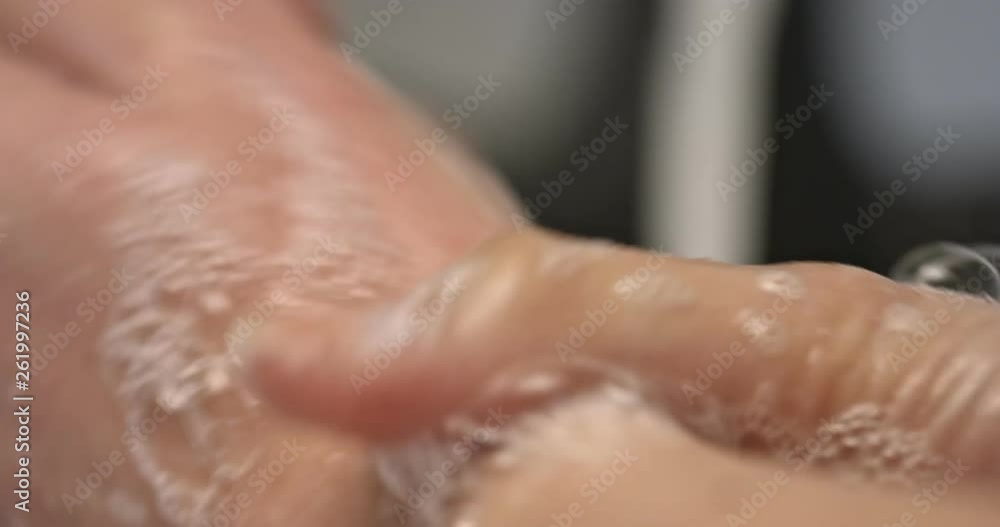 Close view of washing hands with soap in sink. Bacteria protection. Close view of washing hands with soap in sink. Bacteria protection.