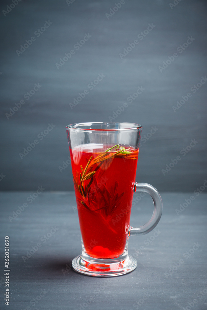 Hot raspberry beverage with rosemary. Selective focus. Shallow depth of field. Hot raspberry beverage with rosemary. Selective focus. Shallow depth of field.