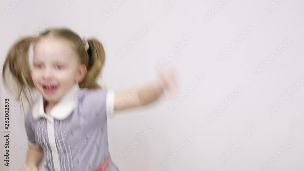 little girl smiling and jumping on white background little girl smiling and jumping on white background