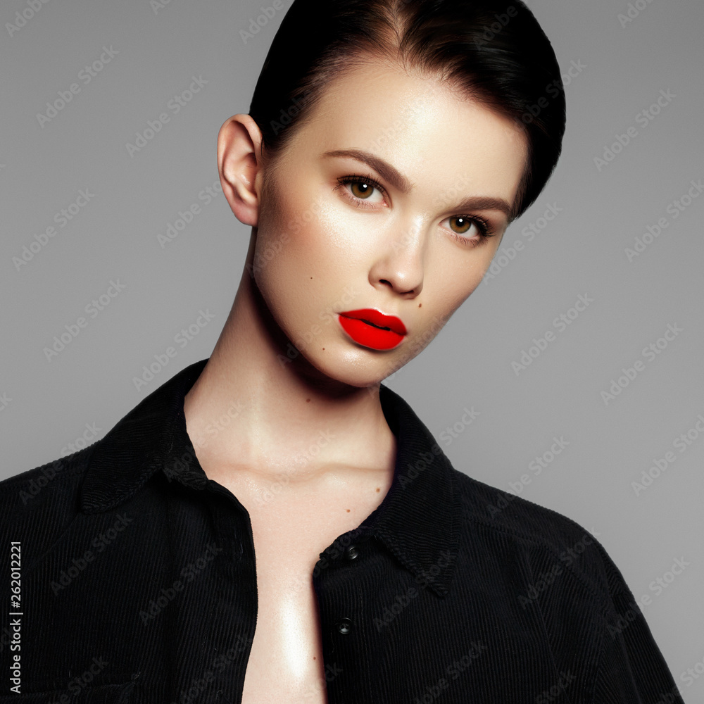 Fashion model portrait. Beautiful young woman on grey background. Model with natural makeup. Fashion make up Fashion model portrait. Beautiful young woman on grey background. Model with natural makeup. Fashion make up