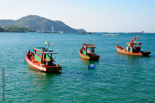 Three fishing boats at Asdang pier at Koh Sichang island, Chonburi, Thailand.