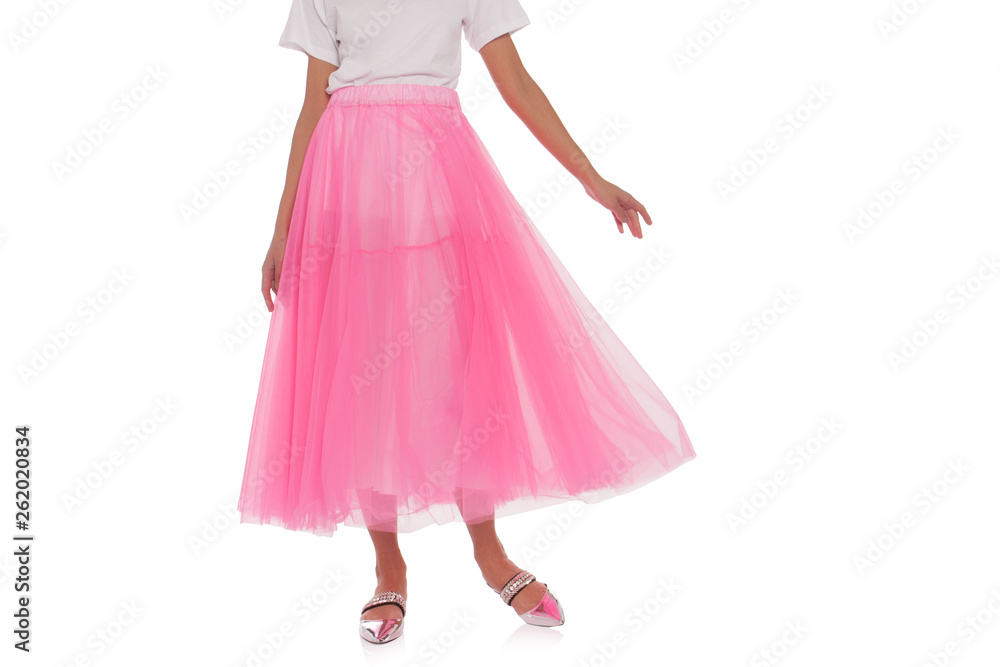 Girl in pink skirt isolated on white