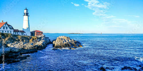 Beautiful Maine Landscape with Clear Skies and Lighthouse with Rocks and the Sea