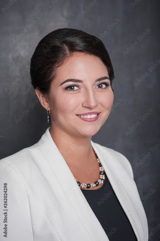 Fototapeta premium Beautiful business woman smile on chalkboard background