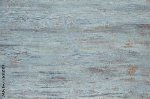 Light grey-blue wooden texture with crackled paint. Aged grunge surface, copy-space