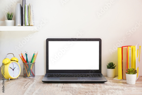 laptop computer white blank screen on work table front view