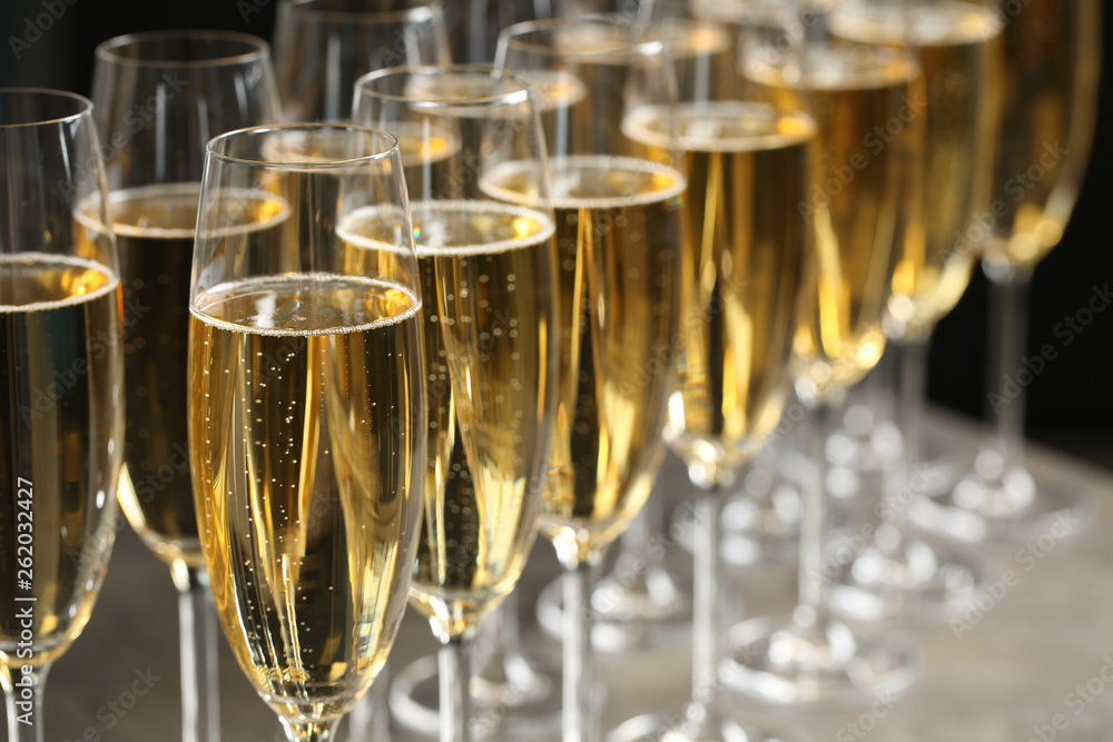 Many glasses of champagne on table, closeup Many glasses of champagne on table, closeup