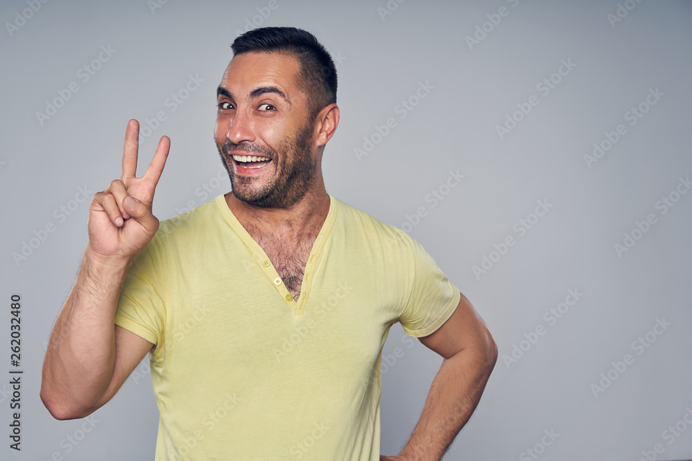 Closeup of casual hispanic man gesturing OK Closeup of casual hispanic man gesturing OK