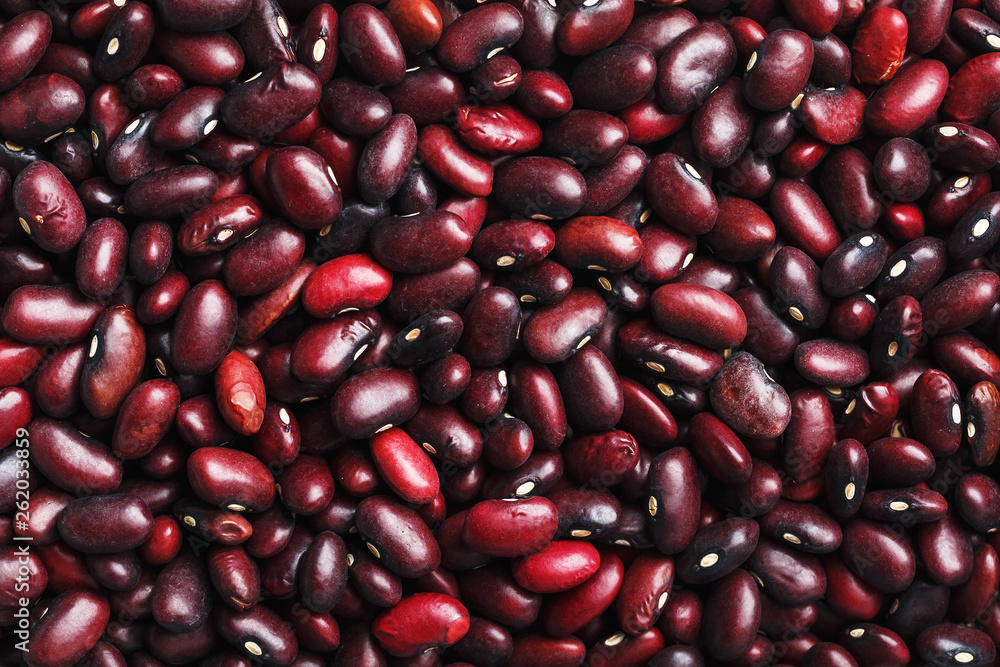 Closeup of a grain of red bean seeds. The texture of the legumes. Close up red beans background, seeds of red beans Closeup of a grain of red bean seeds. The texture of the legumes. Close up red beans background, seeds of red beans