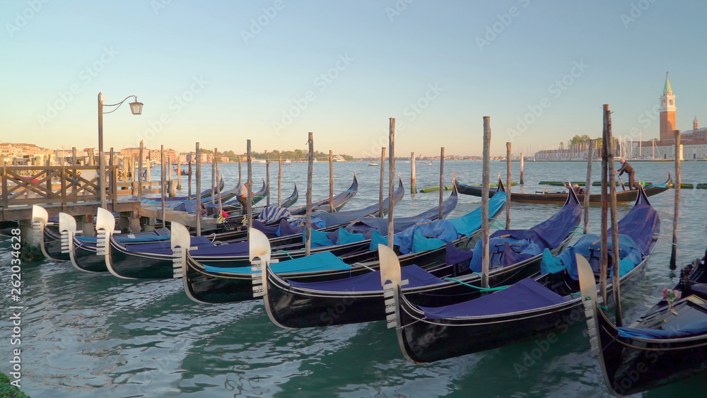 15268_Lots_of_gondolas_docking_on_the_Venice_canal_in_Venice_Italy.jpg