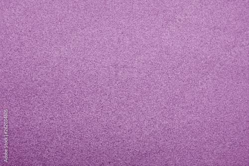 Plastic glittering texture in purple color.