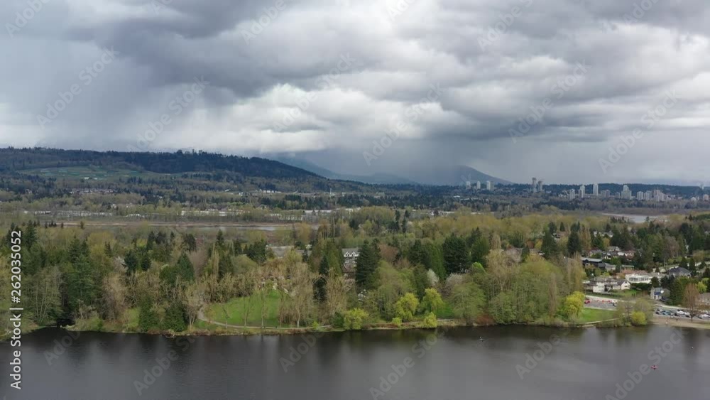 Aerial View at Mountain Lake with Dramatic Clouds in British Columbia, Canada. 4K. Aerial View at Mountain Lake with Dramatic Clouds in British Columbia, Canada. 4K.