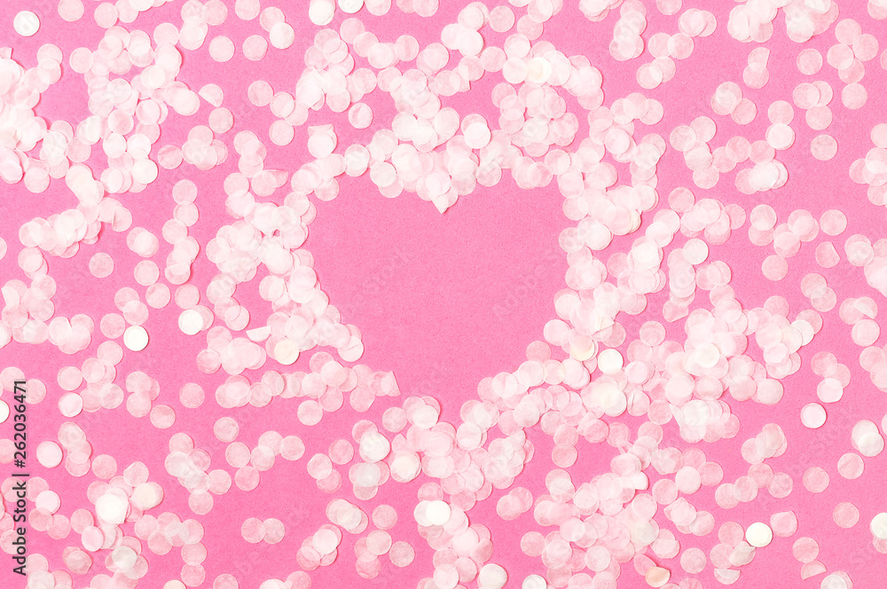 Frame shape of heart from paper round confetti on pastel pink background Flat lay top view. Festive holiday background, concept of party, birthday, christmas or new year. Copyspace for text Frame shape of heart from paper round confetti on pastel pink background Flat lay top view. Festive holiday background, concept of party, birthday, christmas or new year. Copyspace for text