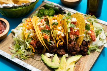 Cinco: Five Tacos On Board With Jalapenos And Avocado