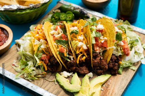 Cinco: Five Tacos On Board With Jalapenos And Avocado