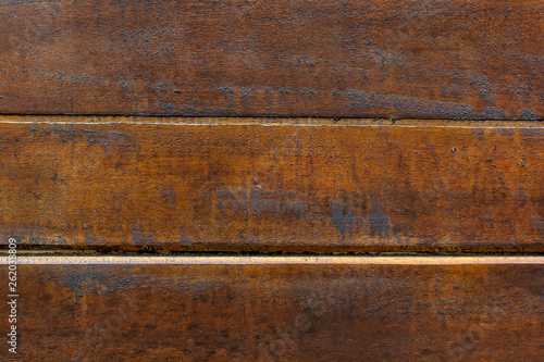 Texture of brown boards with resin painted with impregnation for wood