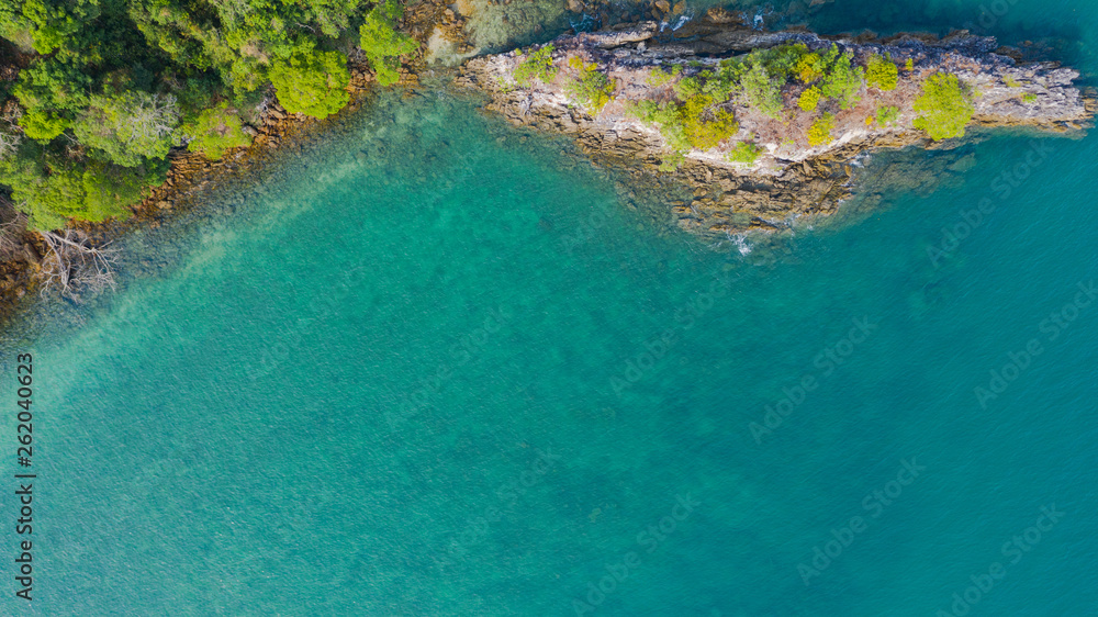 Aerial view photo, Tropical beach with ocean and rock on the island