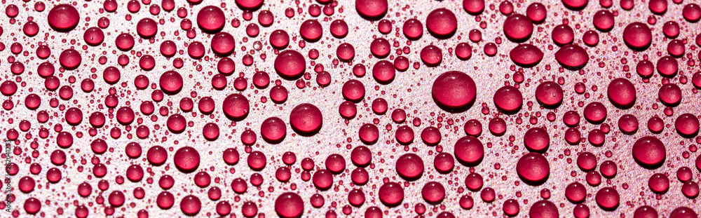 water drops on a red background water drops on a red background