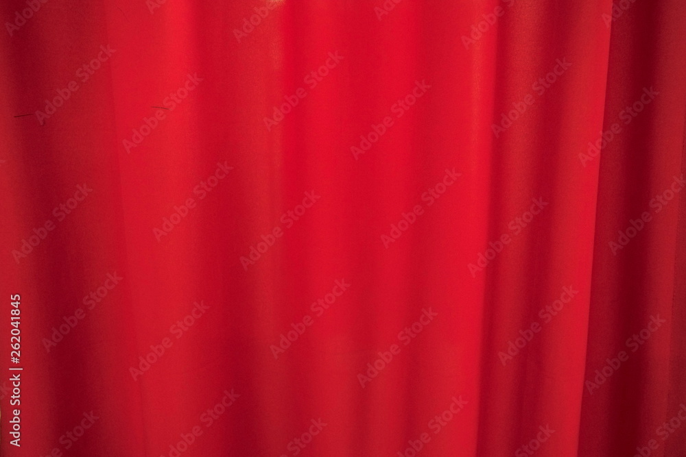 Background of vivid red curtain. Scarlet fabric texture Background of vivid red curtain. Scarlet fabric texture