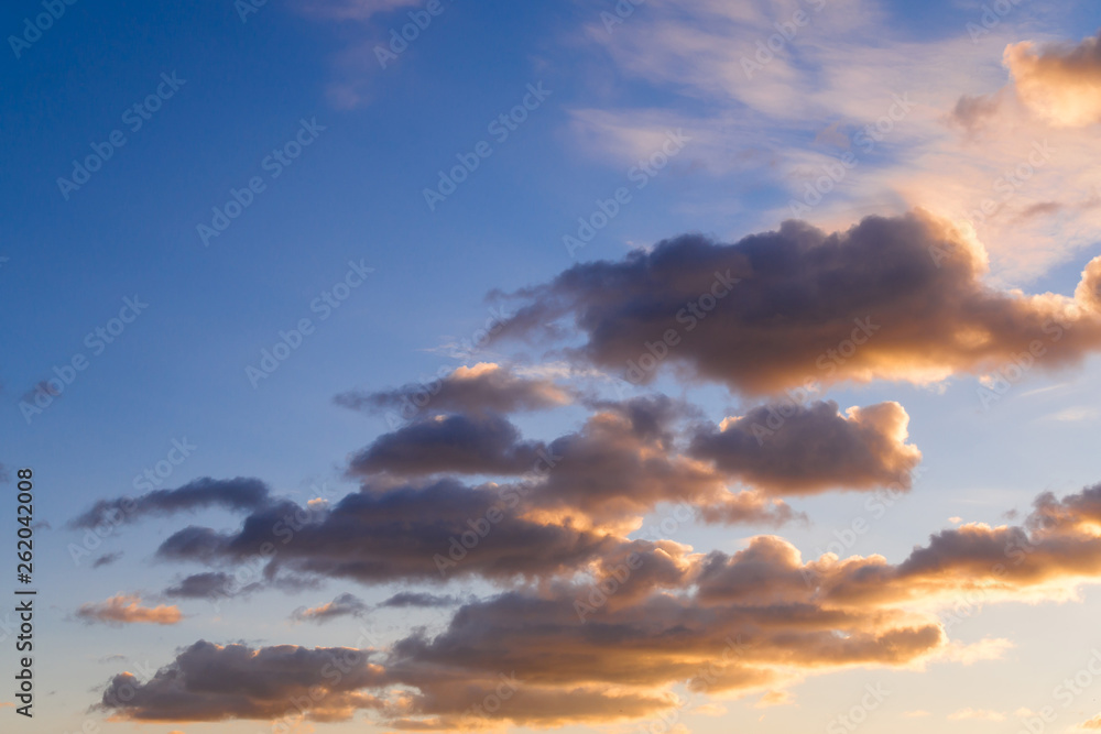 Naklejka premium SPRING SKIES AND CLOUDS WITH REFLECTION OF SUNNY LIGHT