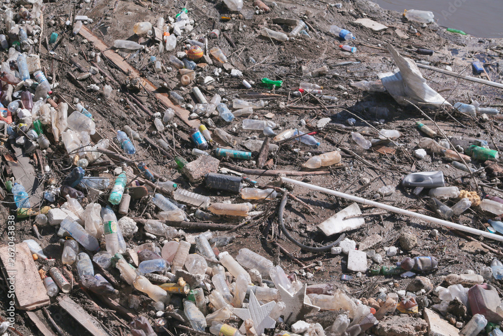 Mountains of city garbage floating in the city river Mountains of city garbage floating in the city river