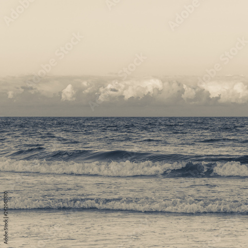 Ocean waves and clouds at sunset in Palm Beach Florida