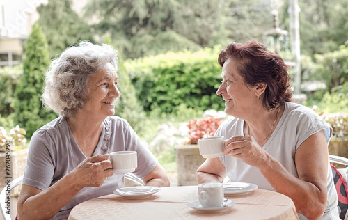 Senior women drinking coffee and talking