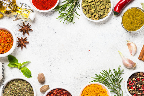 Fototapeta Naklejka Na Ścianę i Meble -  Spices and herbs on white stone table.