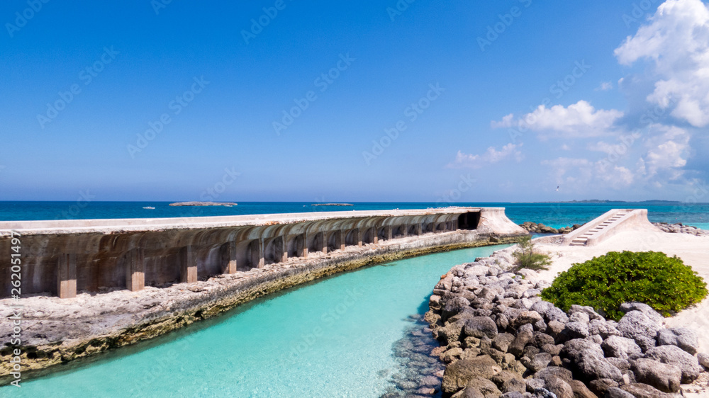 Turquoise river near the Atlantic Ocean during a bright and warm day in the tropics. Nassau, The Bahamas. Turquoise river near the Atlantic Ocean during a bright and warm day in the tropics. Nassau, The Bahamas.